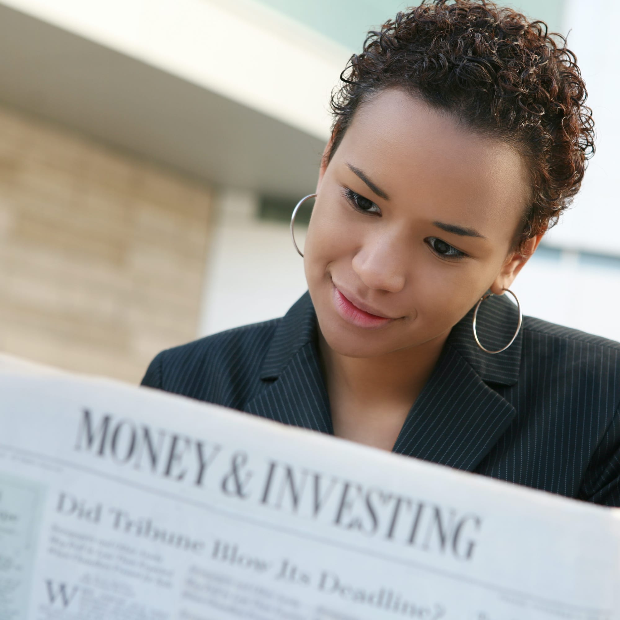 Woman reading newspaper